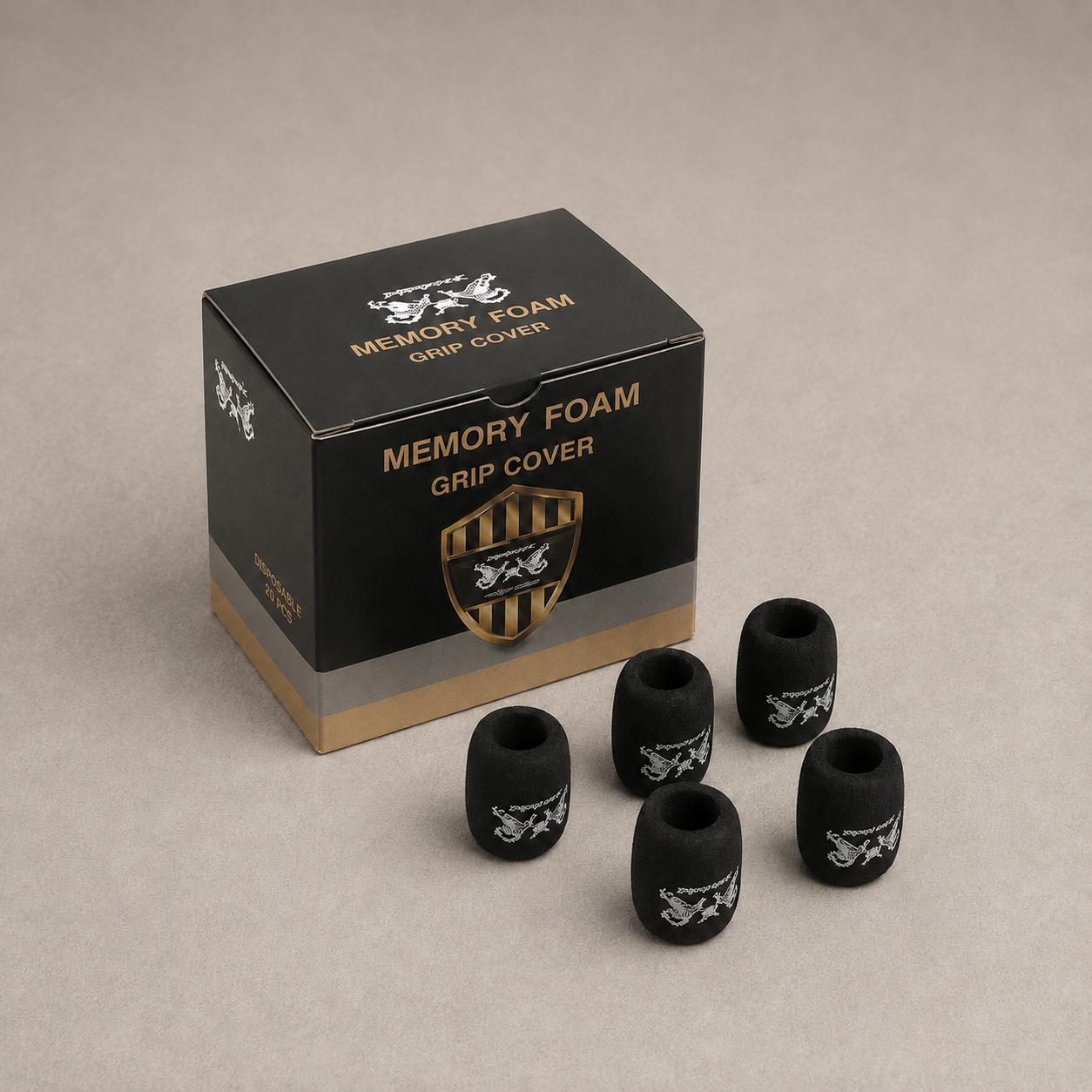 black foam grip covers with white printed logos are displayed in front of their black and gold retail box labeled 'MEMORY FOAM GRIP COVER' on a neutral beige background.