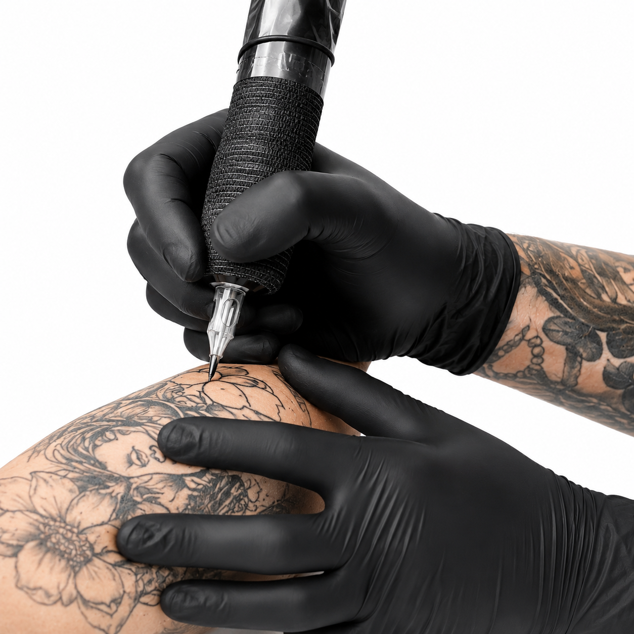 A hand wearing a black nitrile glove holds a box of Phantom Powder Free Latex Examination Gloves. The box is black with a bright blue city skyline graphic and white text, set against a neutral gray background.