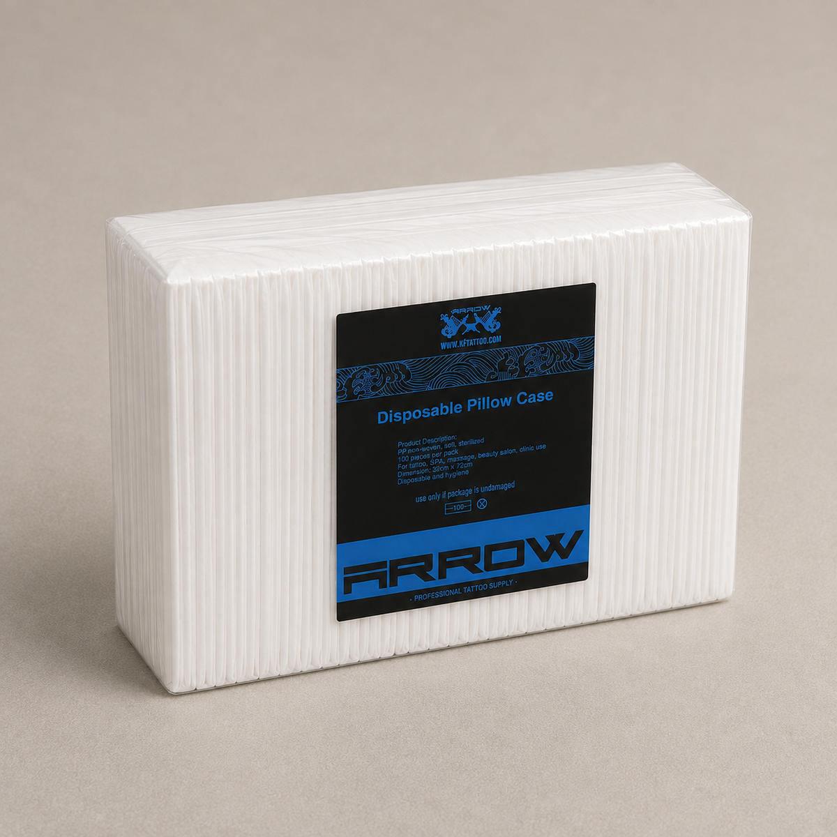 A white rectangular block of ribbed disposable pillow case material with a black and blue ARROW product label, photographed on a plain warm beige background.